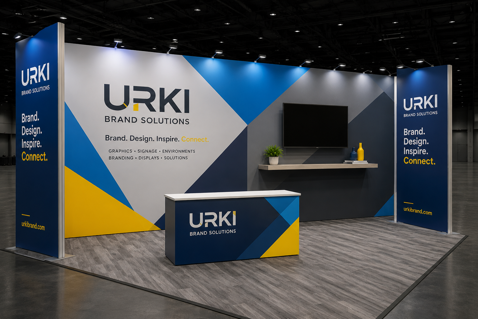 20x10 trade show booth with backdrop, counter, and media shelf in navy, blue, and yellow